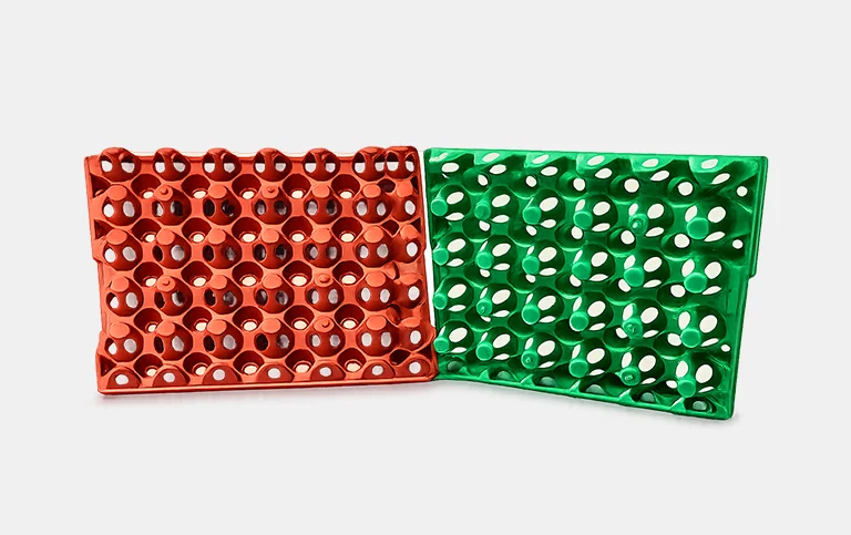 Red and green moulded egg trays