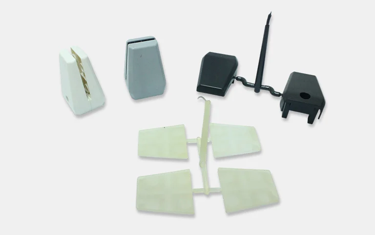 Small white, grey and black housings, caps and clips