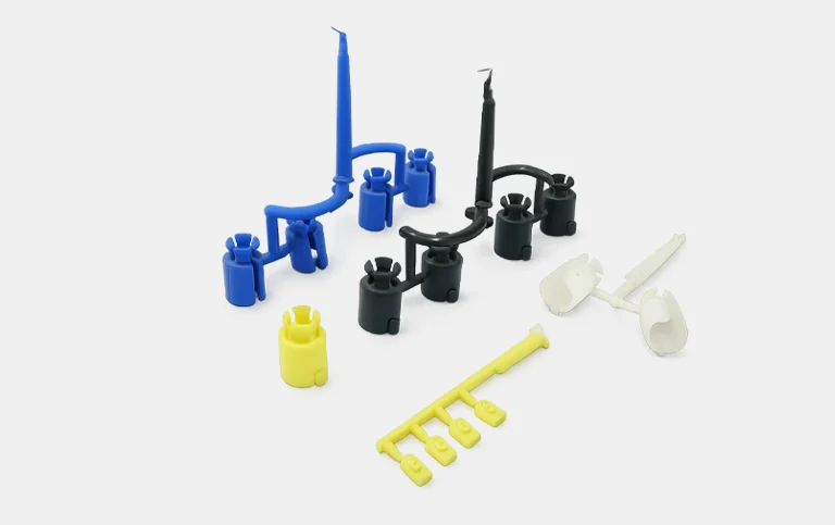 Blue, black, yellow and white connector and plug components with runners