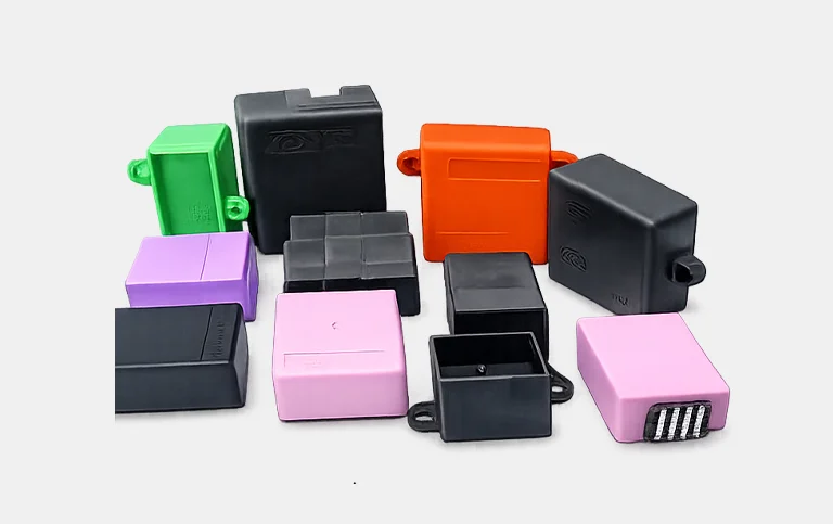 Rectangular module enclosures in black, green, orange and pink