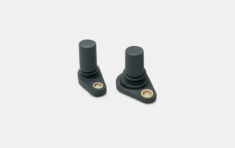 Two black sensor bodies with brass mounting bush