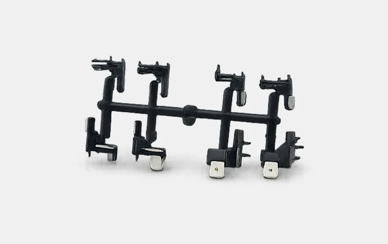 Black terminal housings with metal terminals on a runner
