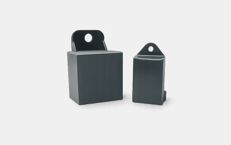 Two grey module covers with mounting tab