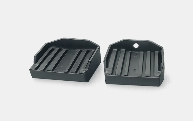 Two black ribbed base trays
