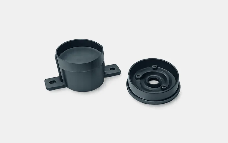 Black round flanged housing with cover