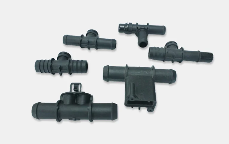 Assorted black tee connectors and manifolds